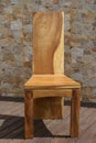 Chair made of solid wood on a stone background