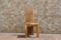 Chair made of solid wood on a stone background