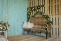 A chair with pillows in rustic setting