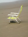 Chair sandals sand beach background Praia Grande Sao Paulo Brazil Royalty Free Stock Photo