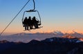 Chair ski lift with skiers Royalty Free Stock Photo