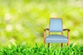 Chair standing on green meadow