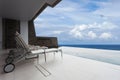 Chair with Swimming pool overlooking view andaman sea and blue s Royalty Free Stock Photo
