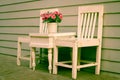 Chair and table with flowers vase Royalty Free Stock Photo