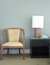 Chair and table lamp in bedroom Royalty Free Stock Photo