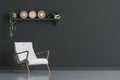 Chair with wall decor in living room interior, black wall mock up background
