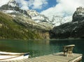 Chair on a wooden pier, Lake O'Hara, Yoho National Park, Canada Royalty Free Stock Photo