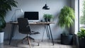 Chair at wooden table with computer monitor and plants in grey Royalty Free Stock Photo