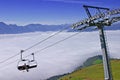 Chairlift above clouds