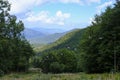 Chairlift across the mountains and cloudy sky. National park Appennino Tosco-Emiliano. Lagdei, Emilia-Romagna Royalty Free Stock Photo