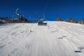 a chairlift leads over an almost deserted slope