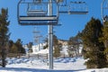 Chairlift line at a winter resort in the mountains. Royalty Free Stock Photo