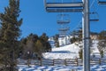 Chairlift line at a winter resort in the mountains. Royalty Free Stock Photo