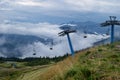 Chairlift in mountains on summer against the background of green Royalty Free Stock Photo