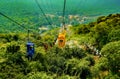 Chairlift ropeway single person sitting watching scenic view of mountains at Rajgir, Bihar, Patna, India