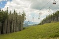 Chairlift ski lift in European Alps. Royalty Free Stock Photo