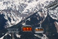 chairlift with snow and trees underneath the blue sunny sky Royalty Free Stock Photo