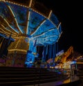 Chairoplane on a festival with blue lights