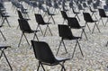 Chairs arranged widely from each in the city center of Locarno.
