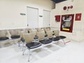 Chairs in empty hospital halls and Fire Extinguisher in Hospitals. Chairs in the hospital hallway.