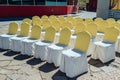 Chairs for guests on wedding ceremony with white and yellow satin cloth outdoor. Royalty Free Stock Photo