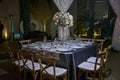 10 chairs table setting, elegant ballroom for wedding reception, decoration ideas, flowers centerpiece Royalty Free Stock Photo