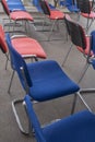 Chairs red and blue in a meeting room. Empty seats in auditorium. Selective focus Royalty Free Stock Photo