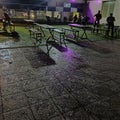 the chairs on the sea pier add to the beauty of the night at the port of surabaya Royalty Free Stock Photo