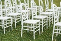 Chairs set up by the green lawn in preparation for a wedding reception