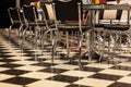 Chairs straightened in an American bar for visitors