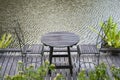 Chairs and table on the backyard in tropical garden near lake with beautiful view in island Borneo, Malaysia Royalty Free Stock Photo