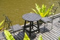 Chairs and table on the backyard in tropical garden near lake with beautiful view in island Borneo, Malaysia Royalty Free Stock Photo