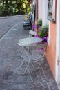 chairs and table at the restaurant terrasse in the street Royalty Free Stock Photo