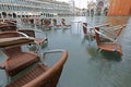 chairs of a bar submerged by the high tide in Piazza San Marco Royalty Free Stock Photo