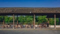Chairs and tables in covered walkway in the old town of Wuzhen, Zhejiang, China Royalty Free Stock Photo