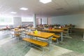 Chairs and tables. The dining hall in school is quarantined, isolation. Royalty Free Stock Photo