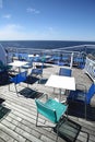 Chairs and tables on a ferry deck Royalty Free Stock Photo