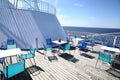 Chairs and tables on a ferry deck Royalty Free Stock Photo