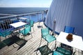 Chairs and tables on a ferry deck Royalty Free Stock Photo