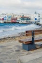 Chairs with tables in Greek tavern in Little Venice part of Mykonos town, Mykonos, Greece Royalty Free Stock Photo