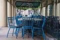 Chairs and tables secured by chains at closed French Quarter Restaurant