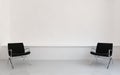Chairs to face a blank wall Royalty Free Stock Photo