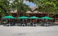 Chairs And Umbrella In Palm Beach for relaxing activity on the beach Royalty Free Stock Photo