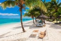 Chairs and umbrella at paradise beach. Tropical holiday banner with sea