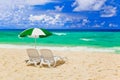 Chairs and umbrella at tropical beach Royalty Free Stock Photo