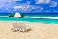 Chairs and umbrella at tropical beach Royalty Free Stock Photo