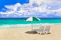 Chairs and umbrella at tropical beach Royalty Free Stock Photo