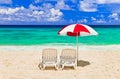 Chairs and umbrella at tropical beach Royalty Free Stock Photo