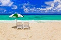Chairs and umbrella at tropical beach Royalty Free Stock Photo