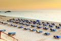 Chairs and umbrellas on beach resort in Greece Royalty Free Stock Photo